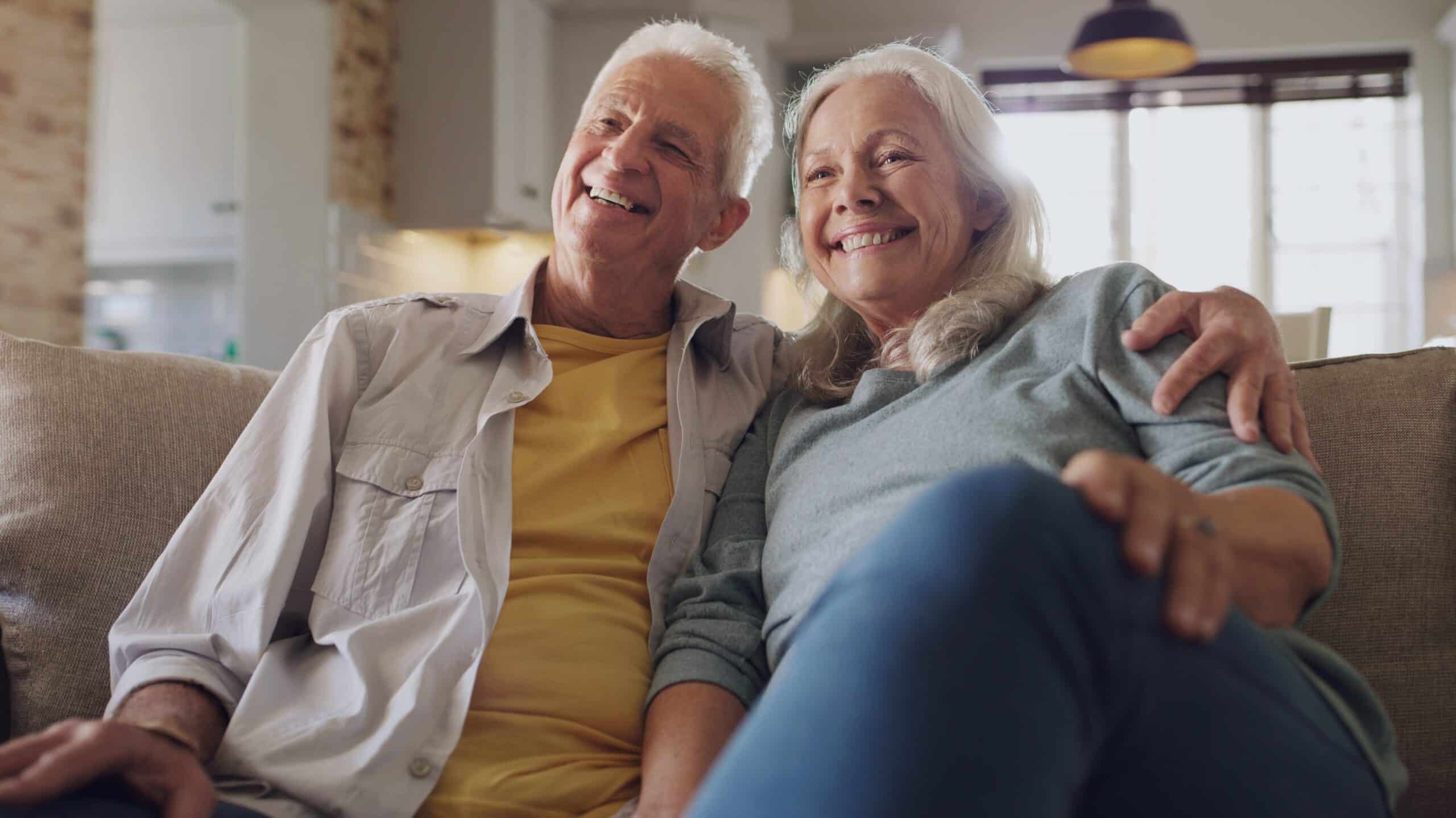 Happy Senior couple sitting on the sofa